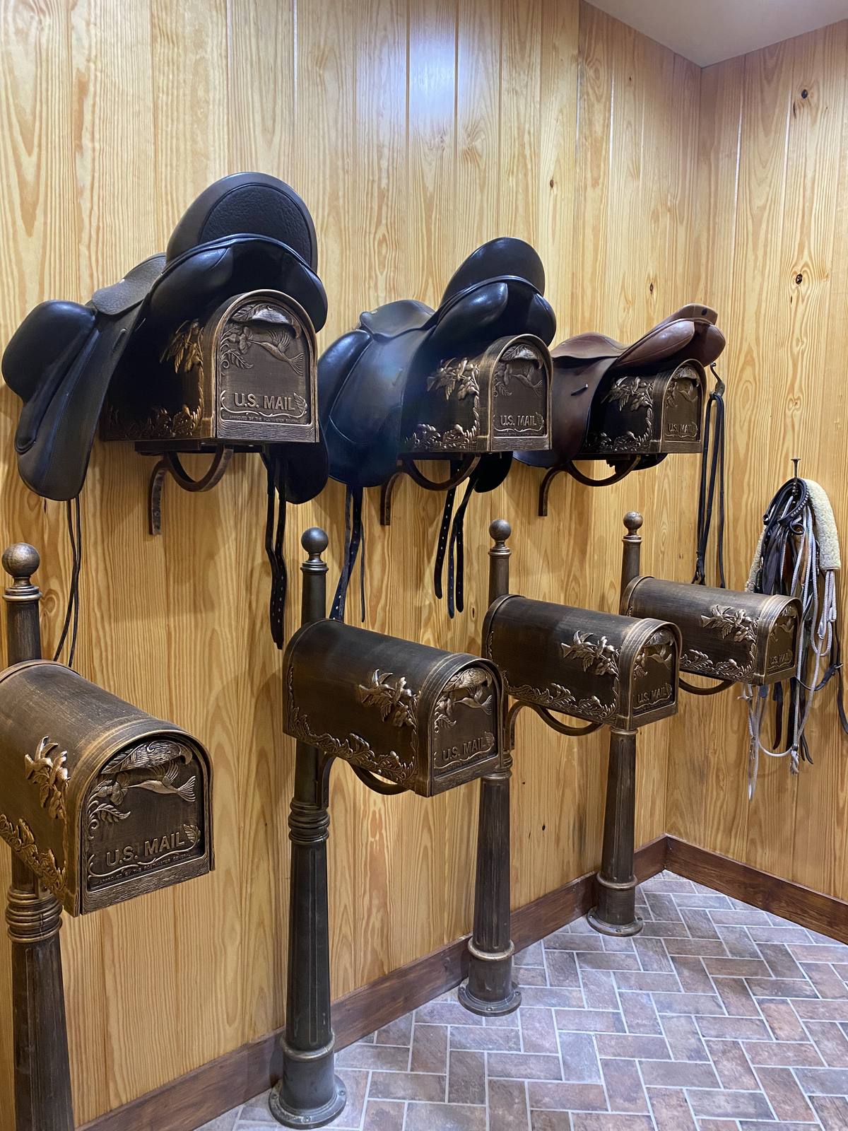The tack room with saddle racks