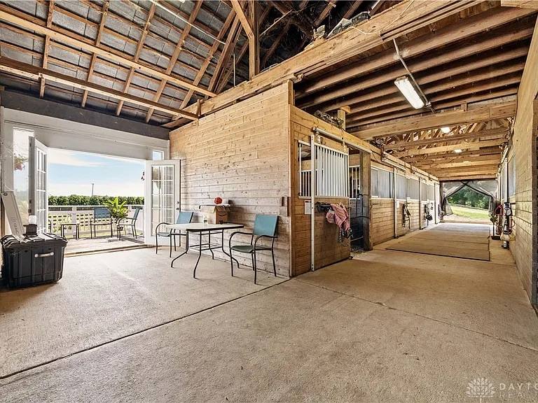 A barn lounge area opening to the paddocks