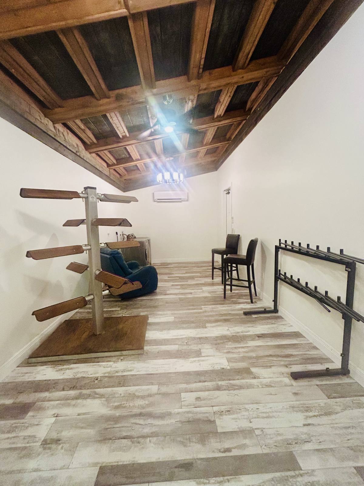 The tack room with saddle racks