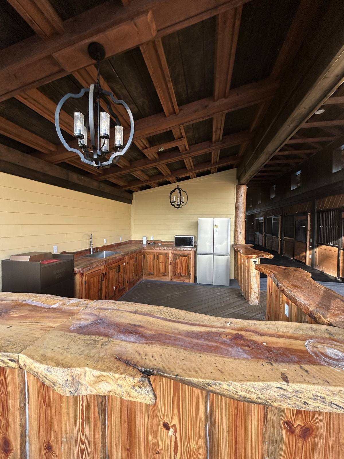 The rider lounge with live-edge bar and kitchen