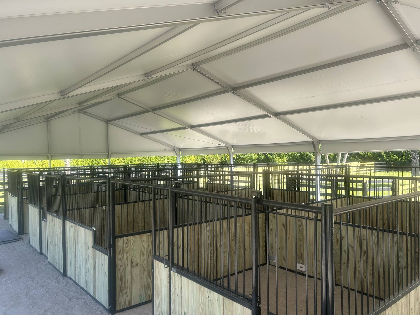 The Tent Barn stalls beneath the clear-span tent