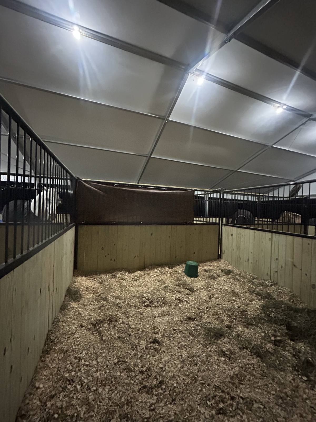 A freshly bedded stall under the tent in the evening