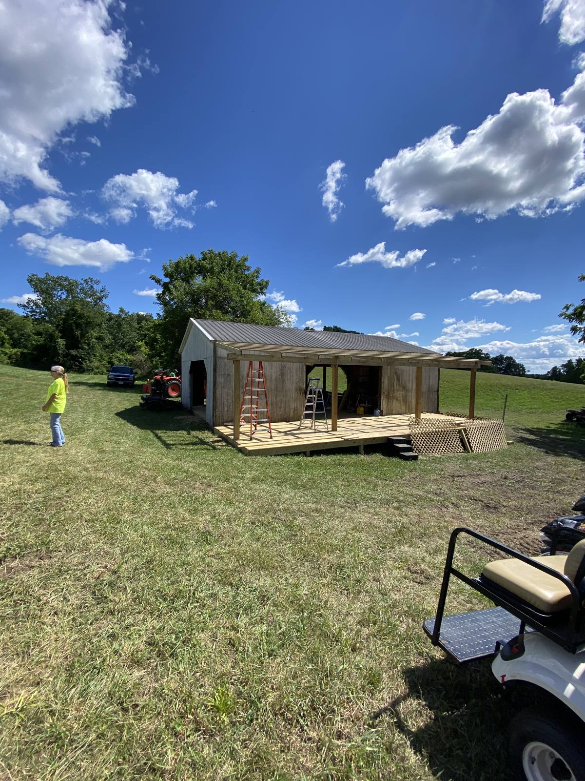 The stage and deck under construction on the green
