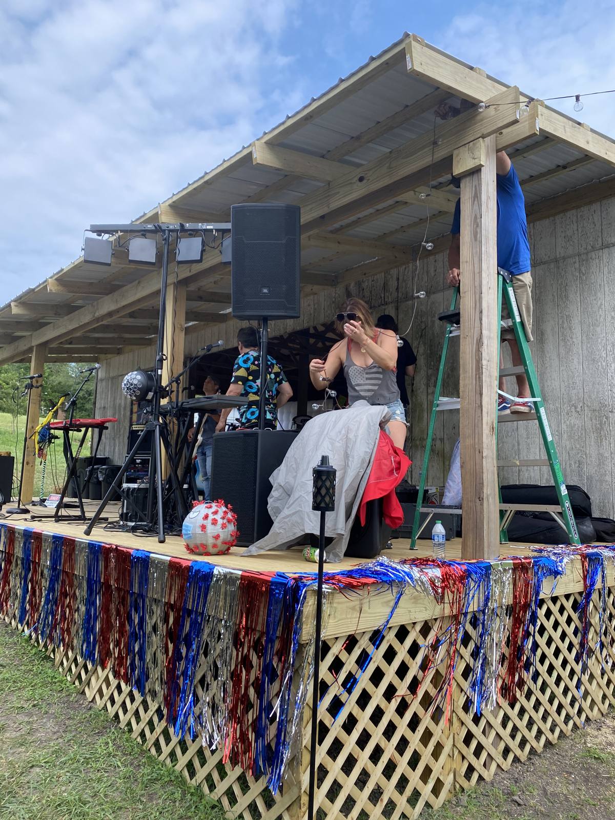 Decorating the stage with lights and bunting