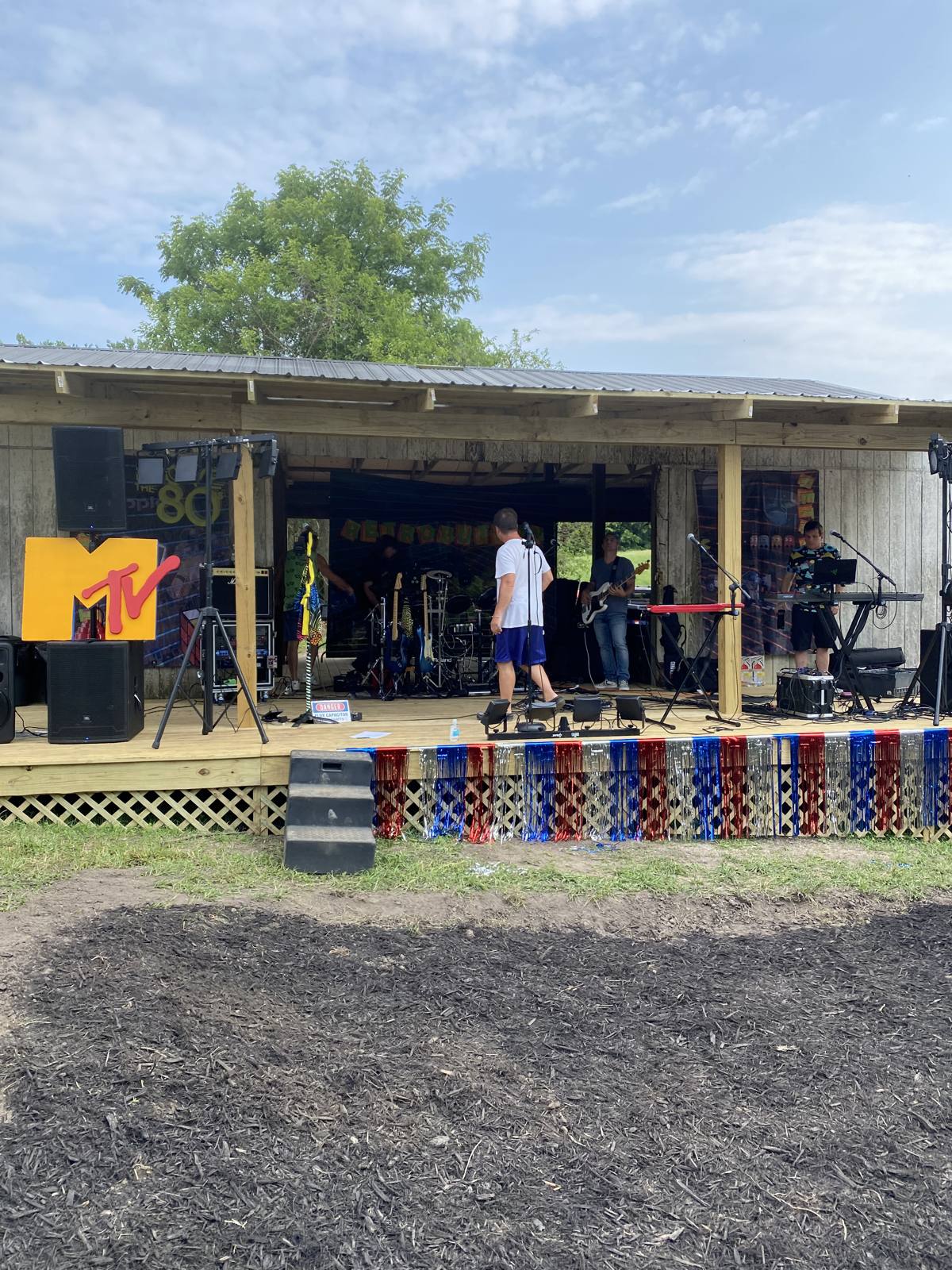 The band on the open-air stage seen from the green